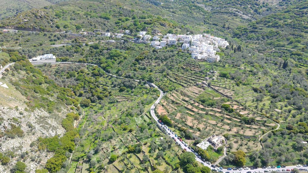 Elevated views from ELaiolithos in Naxos featuring the green Tragea Valley, Cycladic villages, and green mountain landscape