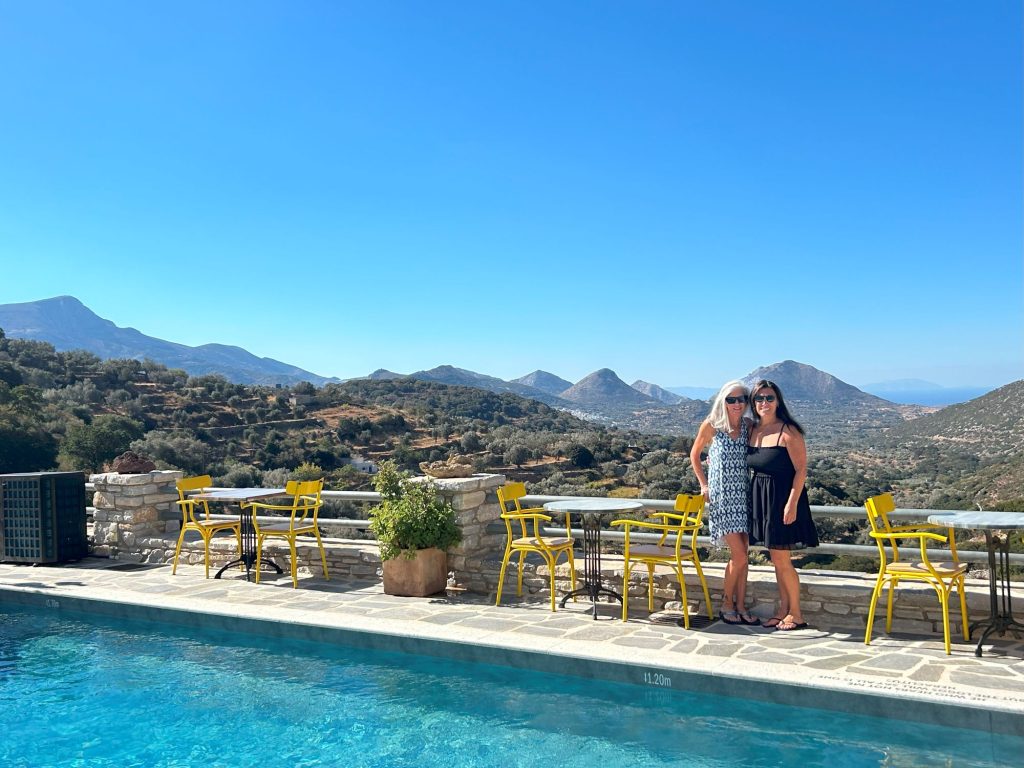Panoramic summit views from ELaiolithos in Naxos, featuring the Tragea Valley, traditional mountain villages, surrounding peaks, and the Aegean Sea