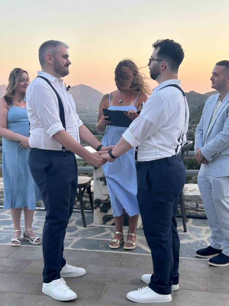 LGBTQ+ couple exchanging vows during an intimate elopement in Naxos at ELaiolithos